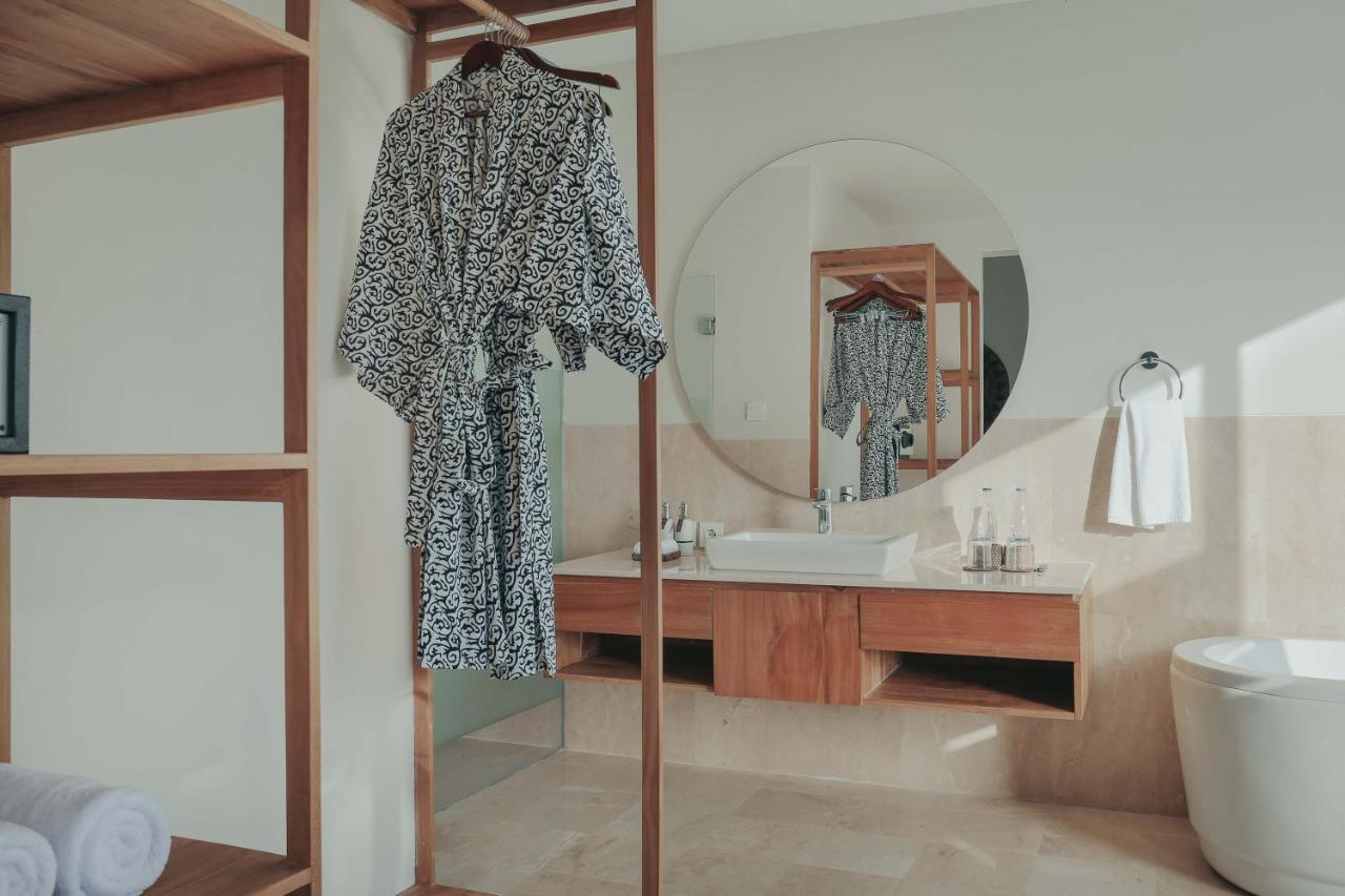 The Sebali Resort Ubud Extérieur photo A bathrobe hanging on a hanger