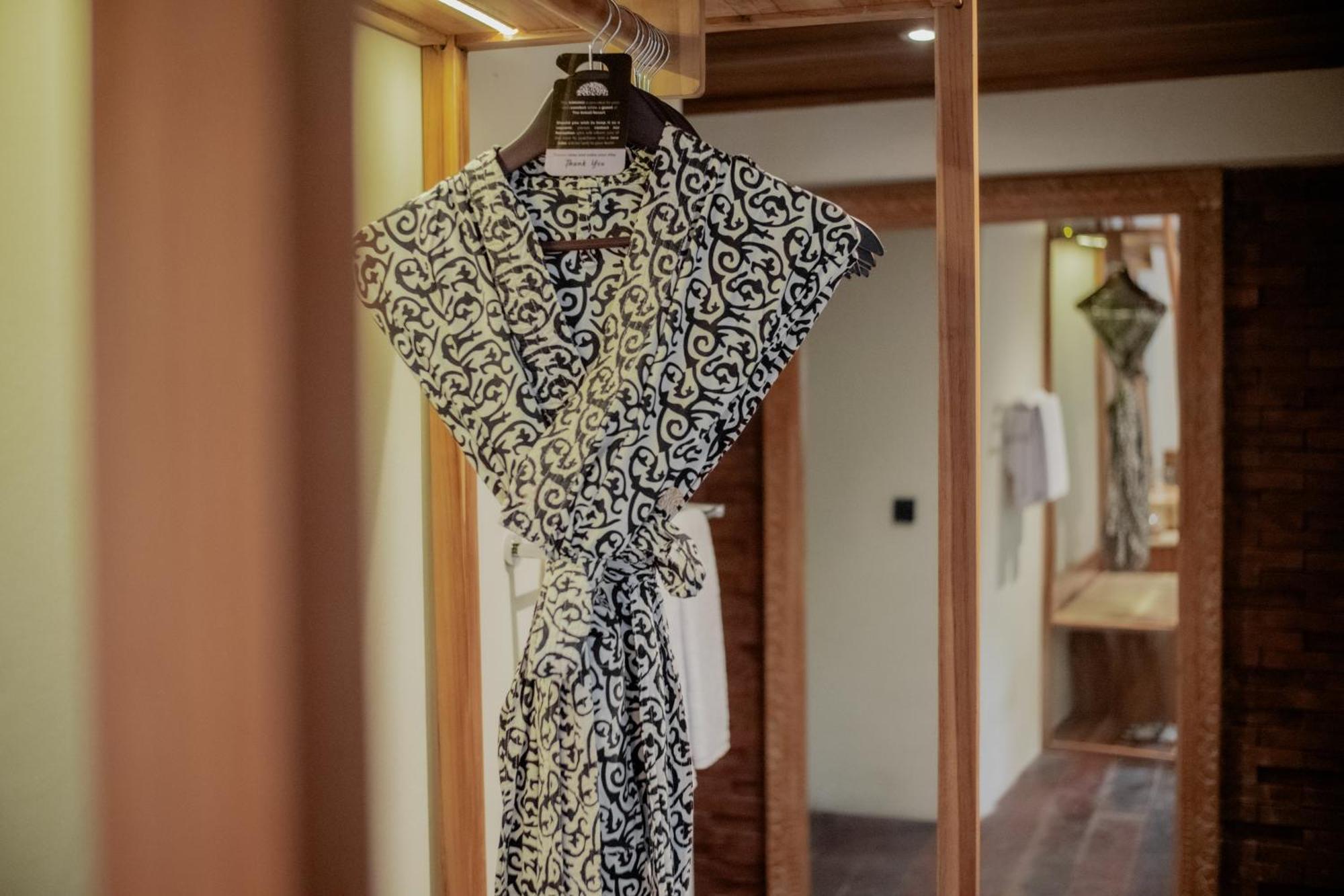 The Sebali Resort Ubud Extérieur photo A bathrobe hanging on a hanger